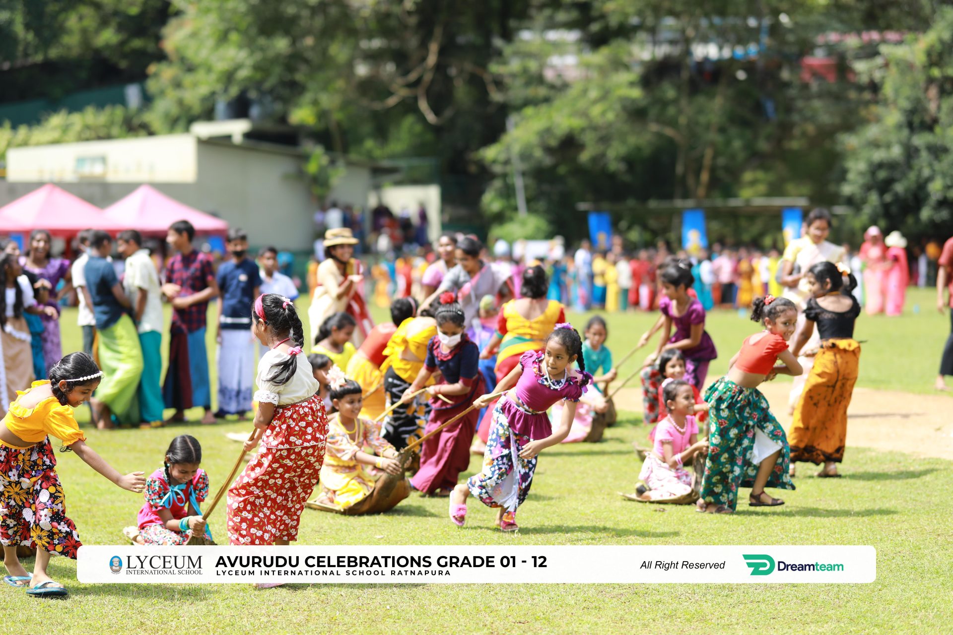 Children enjoying Avurudu tug-of-war at Lyceum International Schools festive celebration.