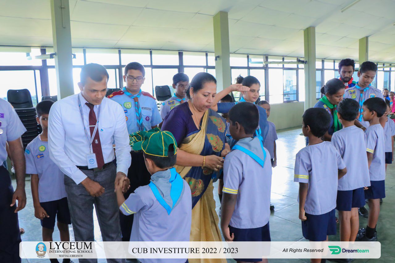 Cub Investiture ceremony at Lyceum International School 2023 with scouts receiving badges.