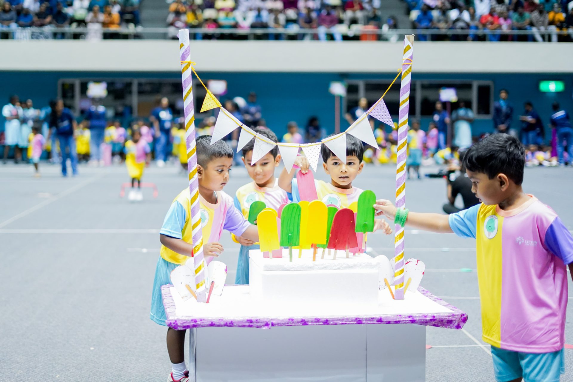 Preschoolers at a colorful, festive sports day event.