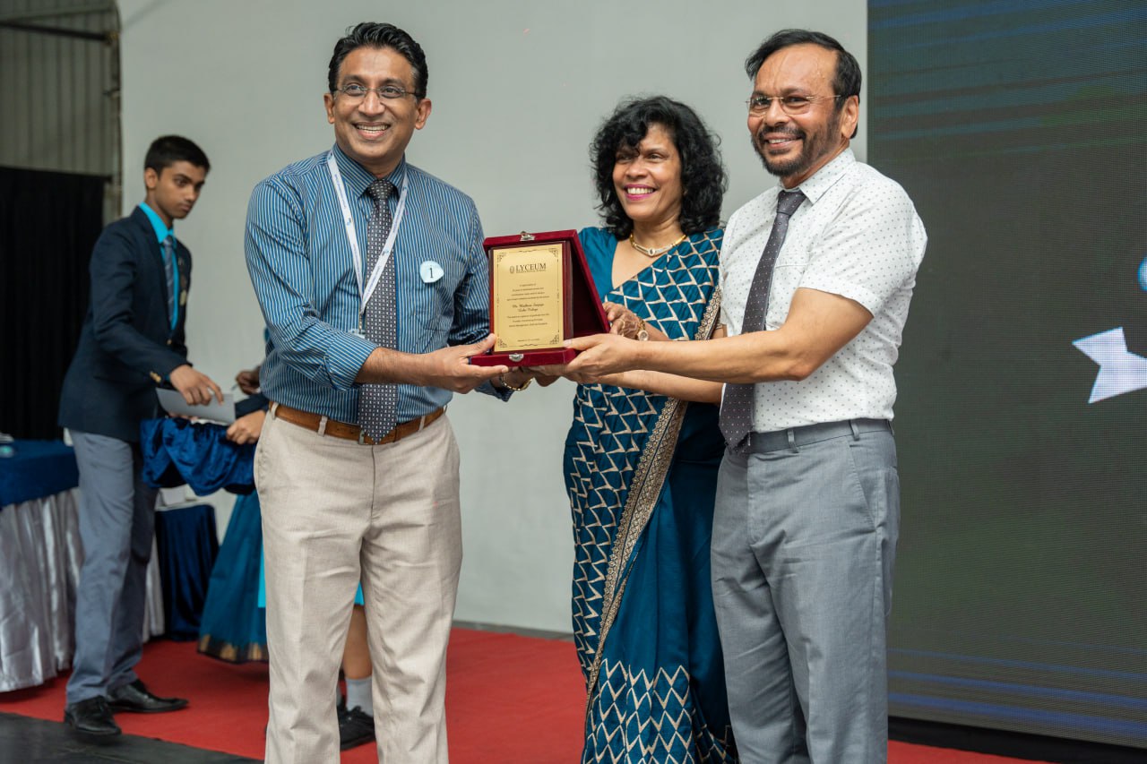 Professional Recognition Ceremony Highlights Unity and Achievement Award ceremony with smiling professionals exchanging a plaque.