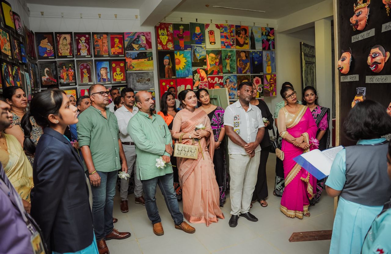 Cultural Art Exhibition: Diverse Group Engages with Speaker Diverse group at vibrant art gallery exhibit listening to a speaker.