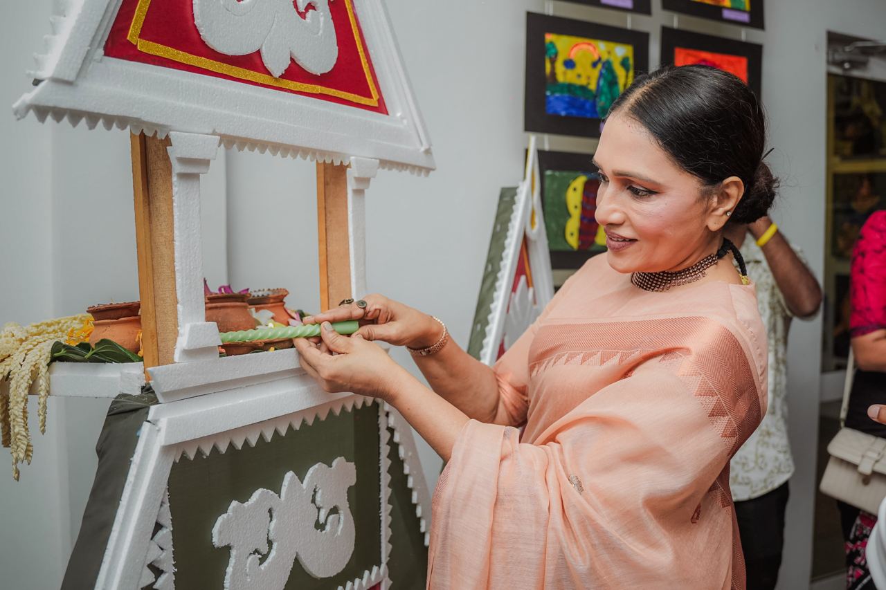 Peach Saree Woman Celebrates Traditional Ceremony Woman in peach saree performs traditional ceremony with decorative setup.