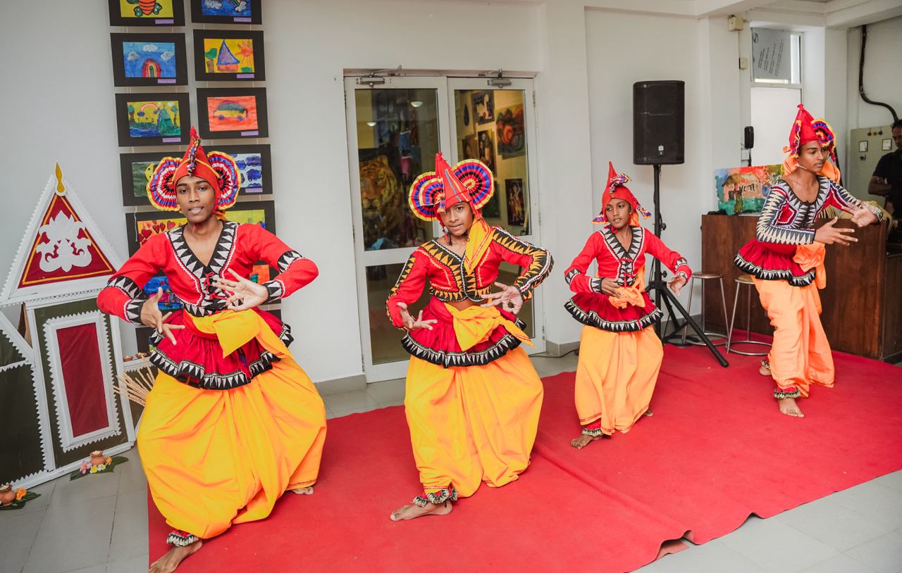 Vibrant Cultural Dance with Colorful Art Backdrop Cultural festival dance with vibrant costumes and colorful childrens artwork.