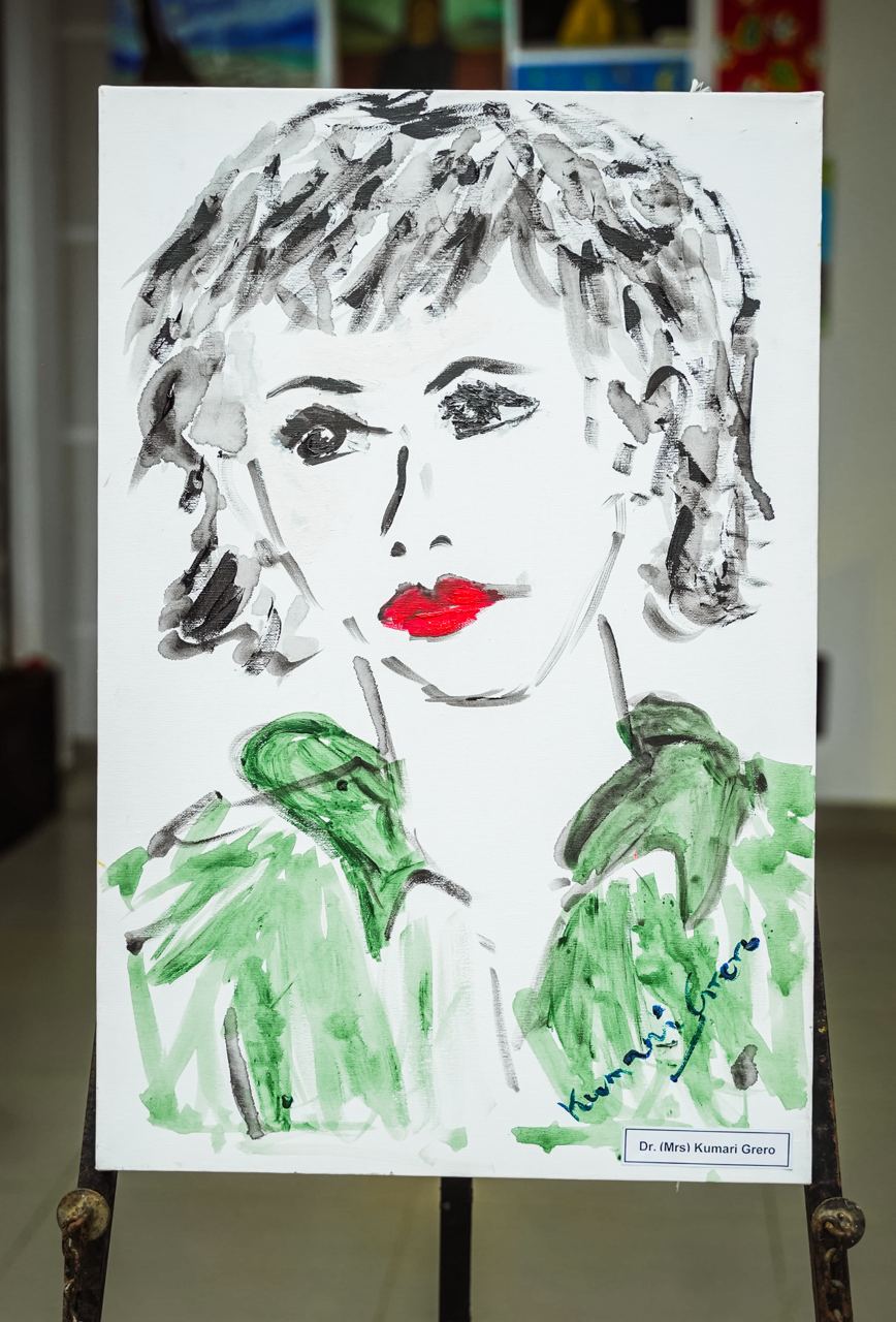 Vivid Minimalist Portrait by Dr. Kumari Grero Expressive minimalist portrait by Dr. Kumari Grero with vibrant red lips and green clothing.