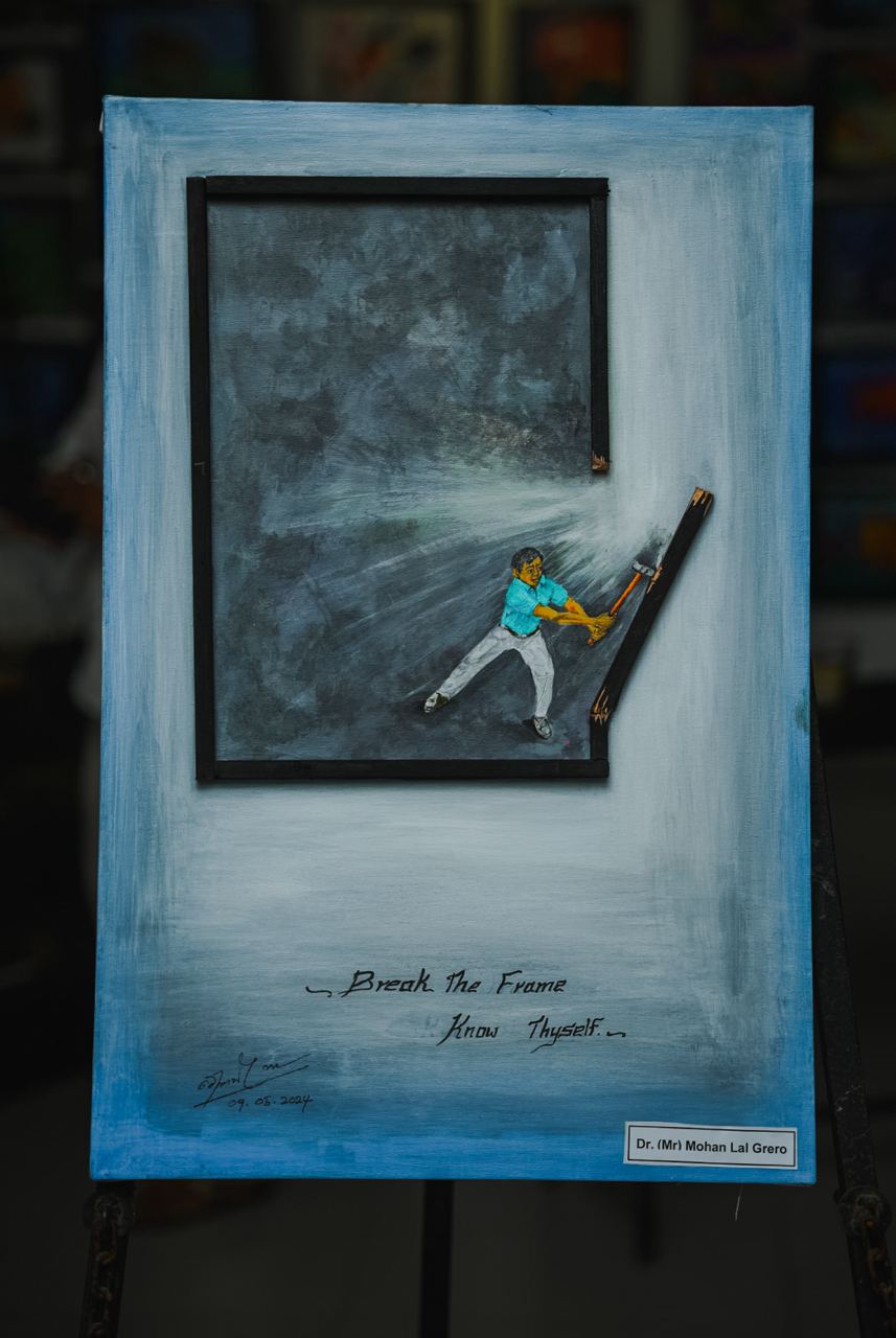 Breaking Boundaries: Art by Dr. Mohan Lal Grero Inspirational artwork by Dr. Mohan Lal Grero, figure breaking through frame with hammer.