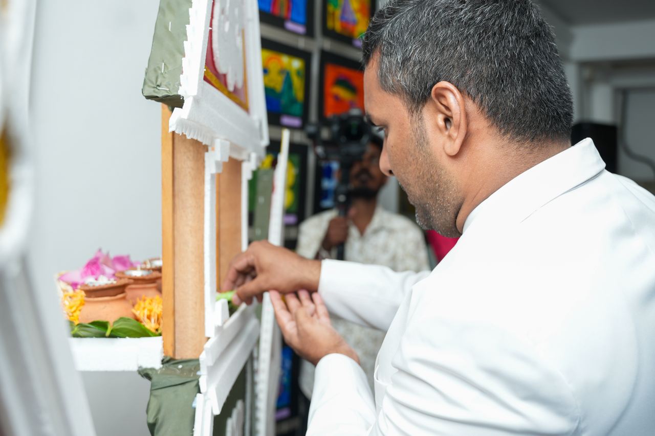Ritual Ceremony at Intricate Shrine with Offerings Man performing ritual at decorated shrine with offerings.
