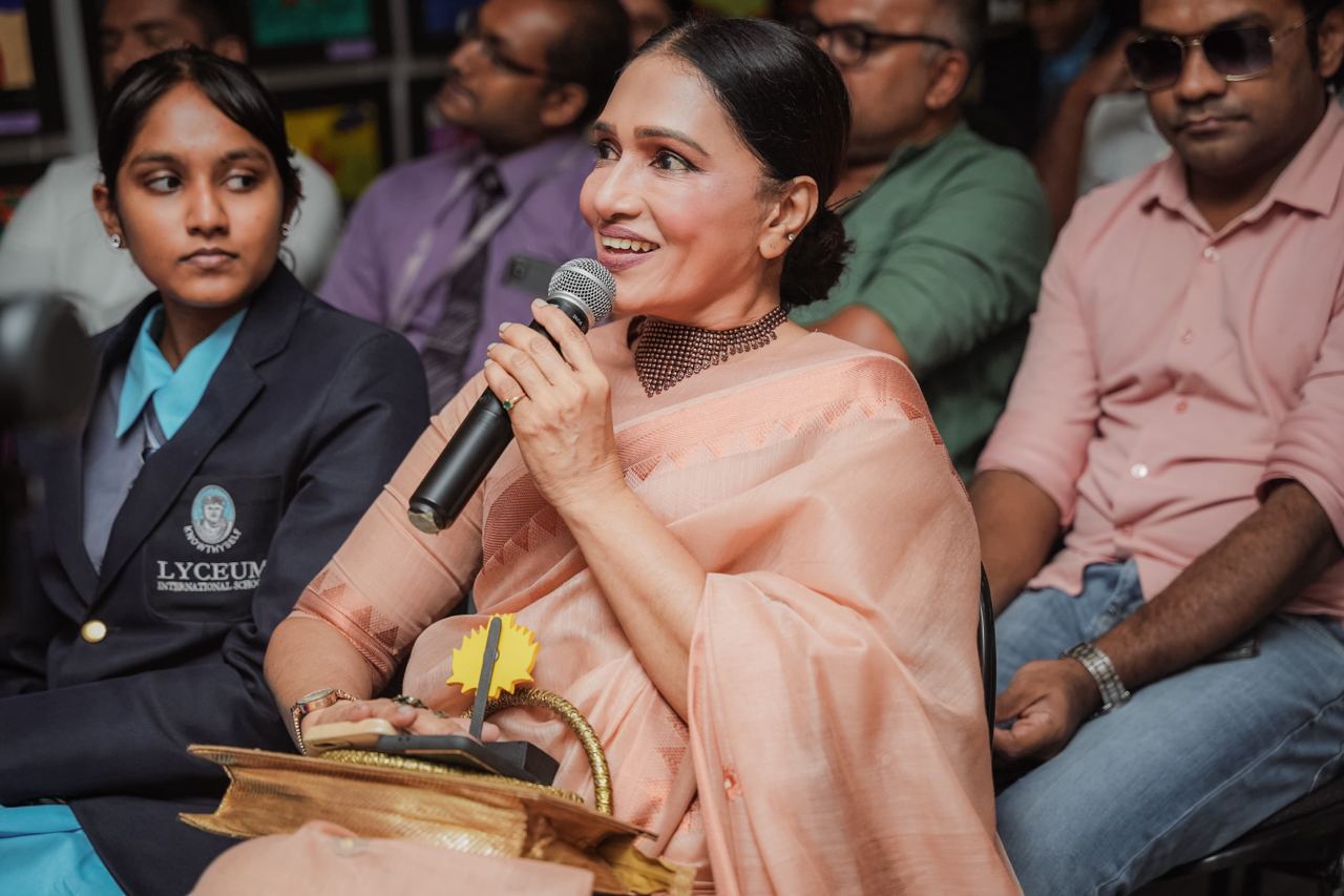 Engaging Speaker at Lyceum School Event Woman speaking at educational event, Lyceum International School students listening attentively.