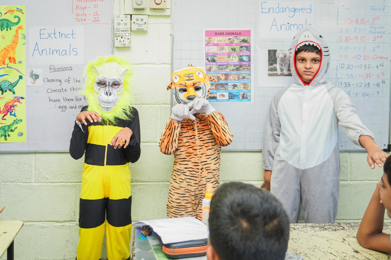 Kids in Animal Costumes Teach About Extinct and Endangered Wildlife Children present on extinct and endangered animals in colorful costumes.