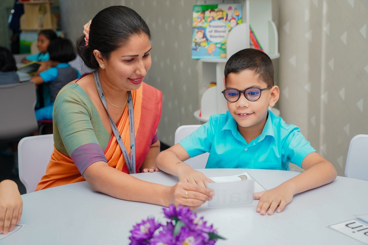 Inspirational Teacher-Student Moment in Vibrant Classroom Inclusive classroom: Teacher guides young student in vibrant, resource-rich setting.