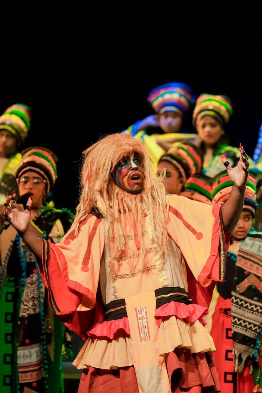 Colorful theatrical performance with vivid costumes, expressive poses, and cultural storytelling.