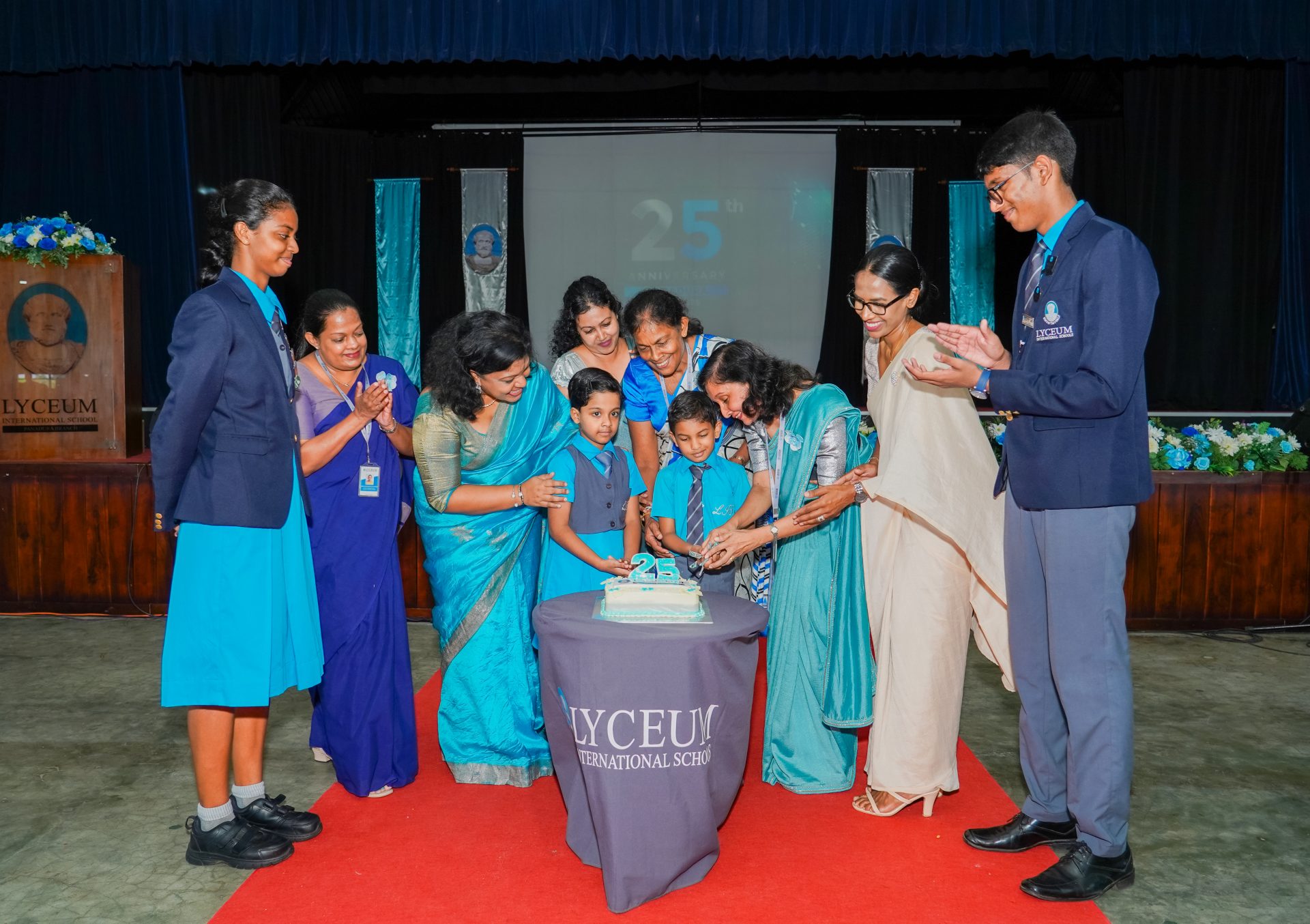Lyceum International School 25th Anniversary Celebration Cake Cutting Lyceum International School 25th anniversary cake cutting with students and staff celebrating together.