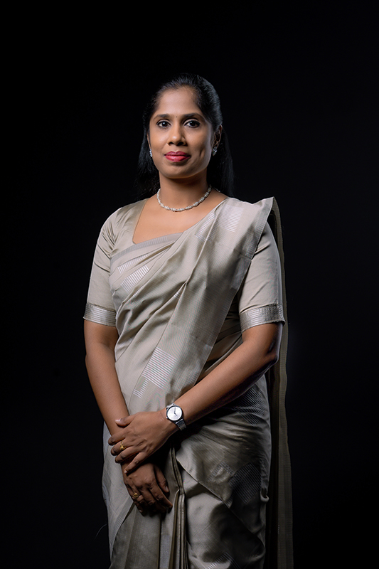 Ms. Sindhuja Rajaram in Elegant Silk Saree Portrait Ms. Sindhuja Rajaram in elegant silk saree, professional portrait, confident Indian businesswoman.