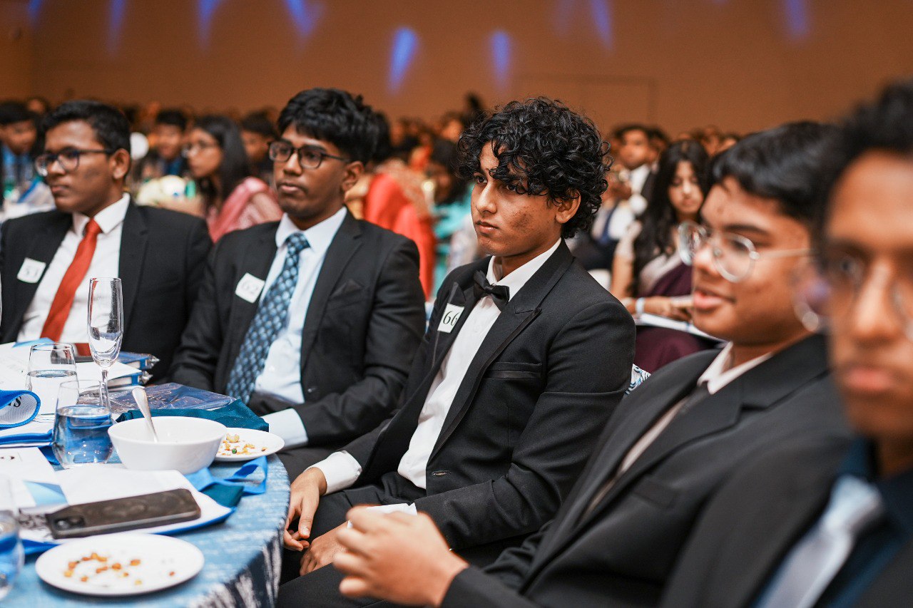 Young Men in Suits at Formal Banquet Conference Young men in suits at a formal banquet event, attending a conference or award ceremony.