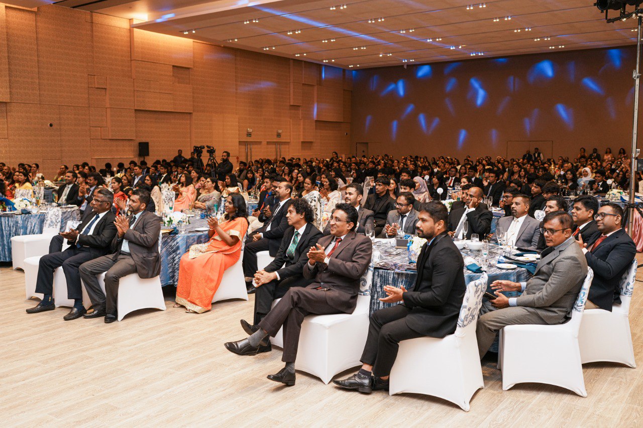 Diverse Business Gala With VIP Guests and Elegant Decor Corporate banquet with diverse attendees, VIPs, formal attire, blue decor, and professional conference setting.