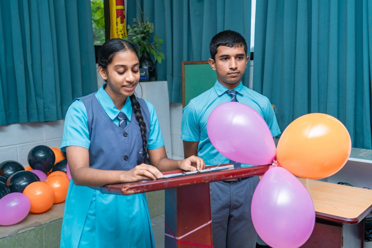 Welcoming childrens classroom with digital screen, bookshelves, plush toys, and playful decor for learning.