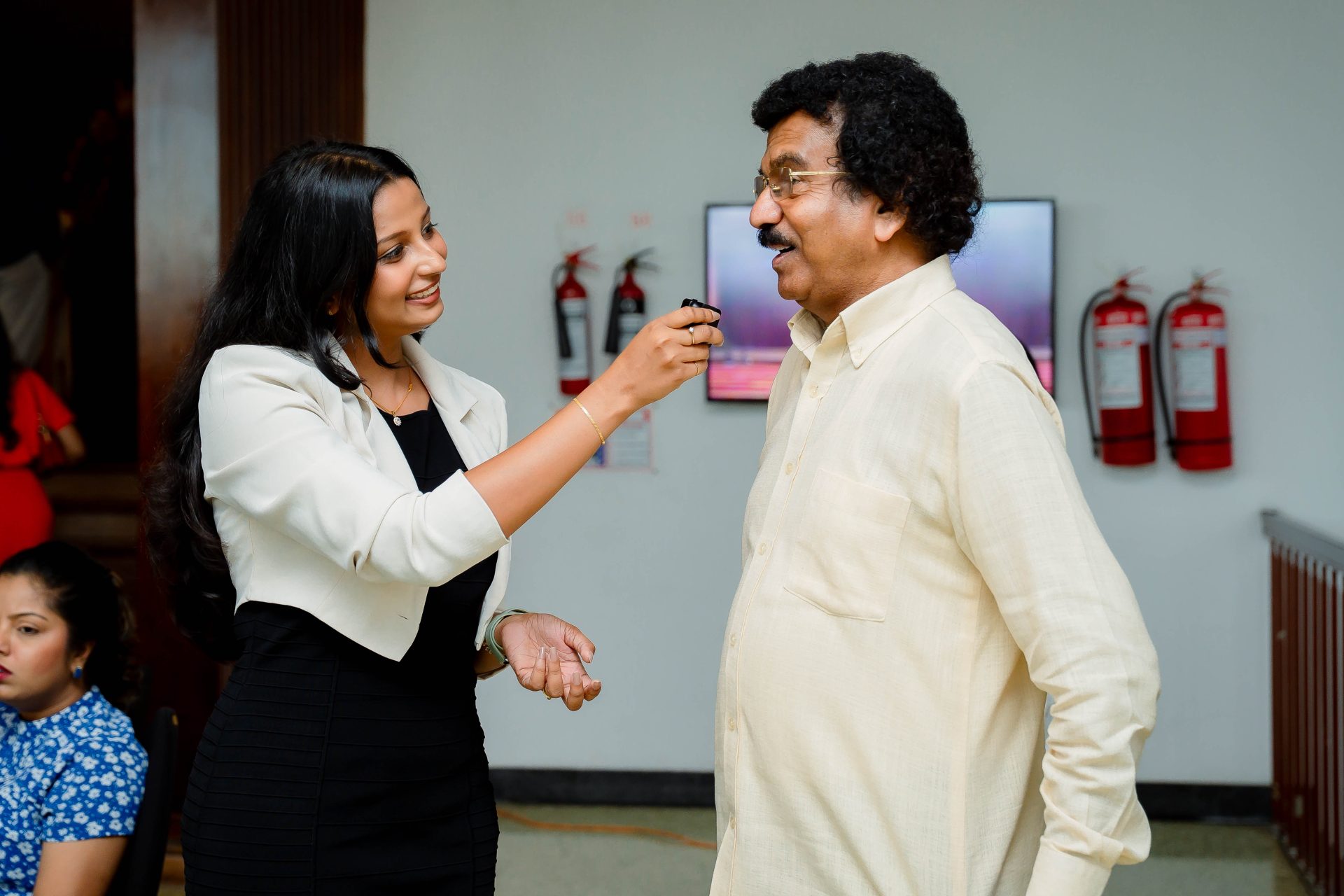 event interview woman man formal setting