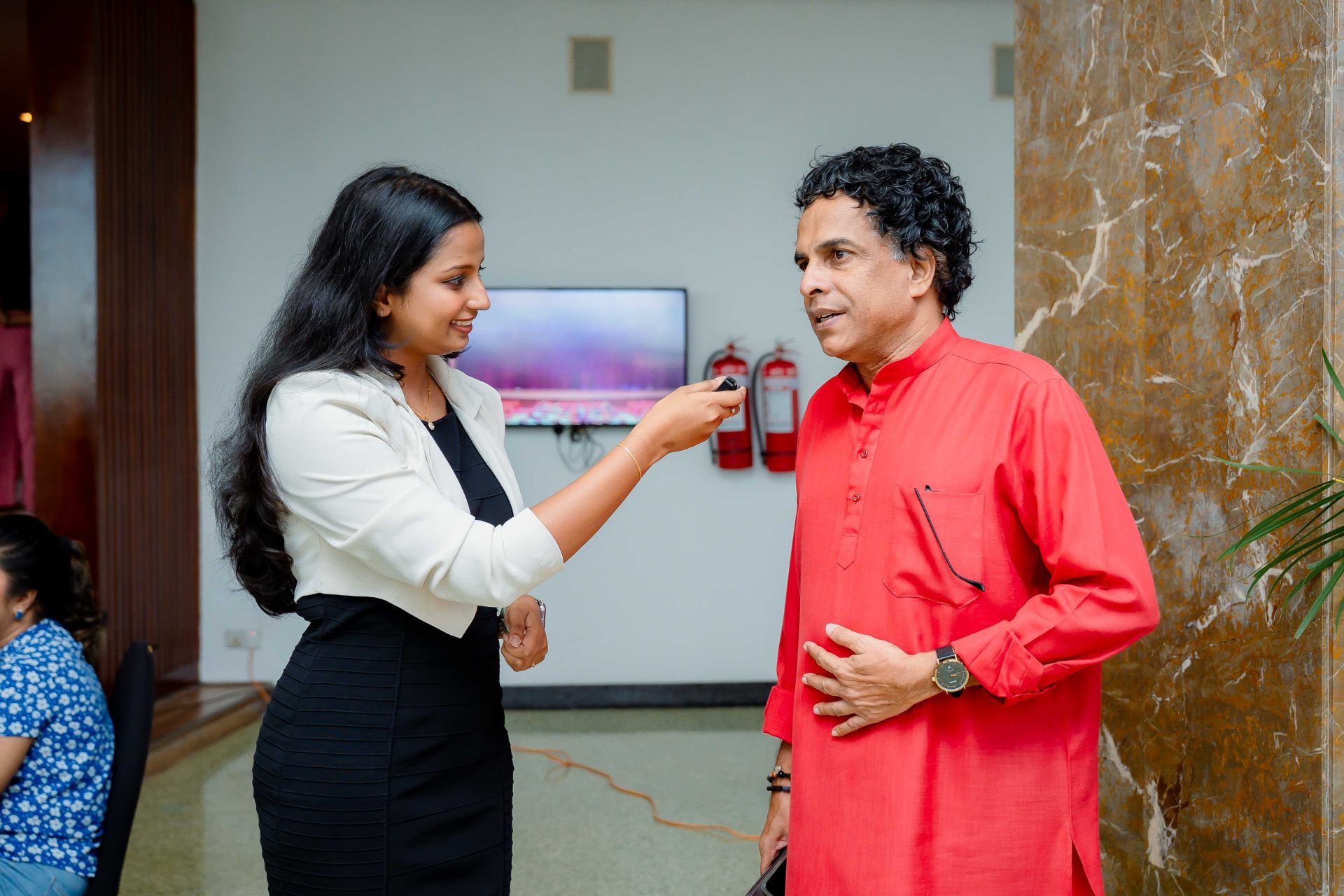 interview man red kurta modern office