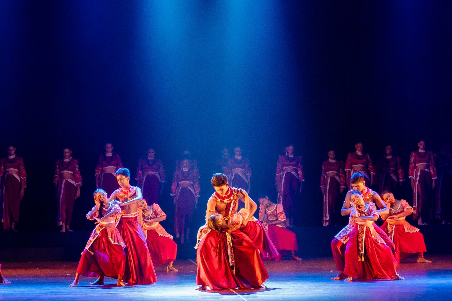 south asian dance blue red stage lights